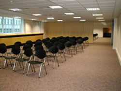 Sliding Folding Timber Partition System, Suspended Ceiling and Conference Desking and Chairs.